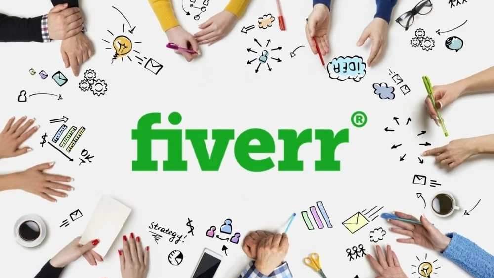 Team collaborating around Fiverr logo with creative doodles.